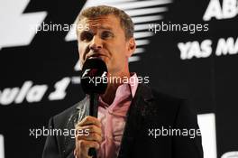 David Coulthard (GBR) Red Bull Racing and Scuderia Toro Advisor / BBC Television Commentator on the podium. 04.11.2012. Formula 1 World Championship, Rd 18, Abu Dhabi Grand Prix, Yas Marina Circuit, Abu Dhabi, Race Day.