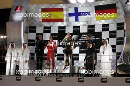 The podium (L to R): Fernando Alonso (ESP) Ferrari, second; Kimi Raikkonen (FIN) Lotus F1 Team, race winner; Sebastian Vettel (GER) Red Bull Racing, third. 04.11.2012. Formula 1 World Championship, Rd 18, Abu Dhabi Grand Prix, Yas Marina Circuit, Abu Dhabi, Race Day.