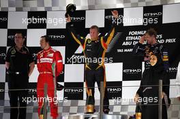 The podium (L to R): Fernando Alonso (ESP) Ferrari, second; Kimi Raikkonen (FIN) Lotus F1 Team, race winner; Sebastian Vettel (GER) Red Bull Racing, third. 04.11.2012. Formula 1 World Championship, Rd 18, Abu Dhabi Grand Prix, Yas Marina Circuit, Abu Dhabi, Race Day.