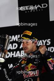 Sebastian Vettel (GER) Red Bull Racing celebrates his third position on the podium. 04.11.2012. Formula 1 World Championship, Rd 18, Abu Dhabi Grand Prix, Yas Marina Circuit, Abu Dhabi, Race Day.