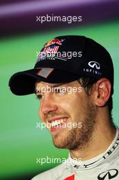 Third placed Sebastian Vettel (GER) Red Bull Racing in the FIA Press Conference. 04.11.2012. Formula 1 World Championship, Rd 18, Abu Dhabi Grand Prix, Yas Marina Circuit, Abu Dhabi, Race Day.