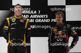 1st place Kimi Raikkonen, Lotus Renault F1 Team with Sebastian Vettel (GER), Red Bull Racing  04.11.2012. Formula 1 World Championship, Rd 18, Abu Dhabi Grand Prix, Abu Dhabi, UAE, Race Day