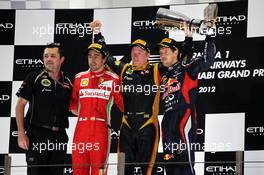 The podium (L to R): Eric Boullier (FRA) Lotus F1 Team Principal; Fernando Alonso (ESP) Ferrari, second; Kimi Raikkonen (FIN) Lotus F1 Team, race winner; Sebastian Vettel (GER) Red Bull Racing, third. 04.11.2012. Formula 1 World Championship, Rd 18, Abu Dhabi Grand Prix, Yas Marina Circuit, Abu Dhabi, Race Day.