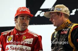 (L to R): Fernando Alonso (ESP) Ferrari with race winner Kimi Raikkonen (FIN) Lotus F1 Team on the podium. 04.11.2012. Formula 1 World Championship, Rd 18, Abu Dhabi Grand Prix, Yas Marina Circuit, Abu Dhabi, Race Day.