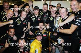 Race winner Kimi Raikkonen (FIN) Lotus F1 Team celebrates with the team. 04.11.2012. Formula 1 World Championship, Rd 18, Abu Dhabi Grand Prix, Yas Marina Circuit, Abu Dhabi, Race Day.