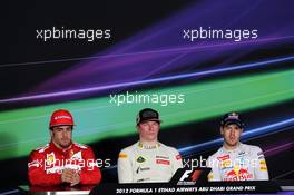 The FIA Press Conference (L to R): Fernando Alonso (ESP) Ferrari, second; Kimi Raikkonen (FIN) Lotus F1 Team, race winner; Sebastian Vettel (GER) Red Bull Racing, third. 04.11.2012. Formula 1 World Championship, Rd 18, Abu Dhabi Grand Prix, Yas Marina Circuit, Abu Dhabi, Race Day.