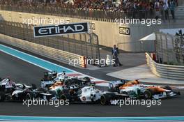 A crash at the start of the race involving Paul di Resta (GBR) Sahara Force India VJM05; Nico Hulkenberg (GER) Sahara Force India F1 VJM05; Bruno Senna (BRA) Williams; Romain Grosjean (FRA) Lotus F1 E20 and Sergio Perez (MEX) Sauber C31. 04.11.2012. Formula 1 World Championship, Rd 18, Abu Dhabi Grand Prix, Yas Marina Circuit, Abu Dhabi, Race Day.