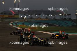 Heikki Kovalainen (FIN) Caterham CT01 leads Jean-Eric Vergne (FRA) Scuderia Toro Rosso STR7 and Sebastian Vettel (GER) Red Bull Racing RB8. 04.11.2012. Formula 1 World Championship, Rd 18, Abu Dhabi Grand Prix, Yas Marina Circuit, Abu Dhabi, Race Day.