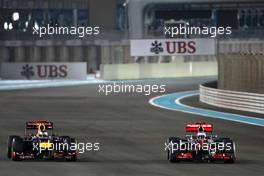 Sebastian Vettel (GER), Red Bull Racing overtake Jenson Button (GBR), McLaren Mercedes for third place 04.11.2012. Formula 1 World Championship, Rd 18, Abu Dhabi Grand Prix, Abu Dhabi, UAE, Race Day