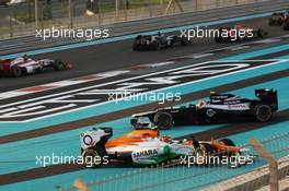 A crash at the start of the race involving Nico Hulkenberg (GER) Sahara Force India F1 VJM05 and Bruno Senna (BRA) Williams FW34. 04.11.2012. Formula 1 World Championship, Rd 18, Abu Dhabi Grand Prix, Yas Marina Circuit, Abu Dhabi, Race Day.