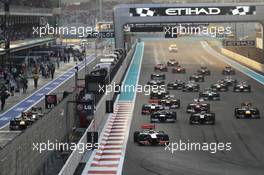 Lewis Hamilton (GBR) McLaren MP4/27 leads at the start of the race with Sebastian Vettel (GER) Red Bull Racing and Pedro De La Rosa (ESP) HRT Formula 1 Team F112 starting from the pit lane. 04.11.2012. Formula 1 World Championship, Rd 18, Abu Dhabi Grand Prix, Yas Marina Circuit, Abu Dhabi, Race Day.