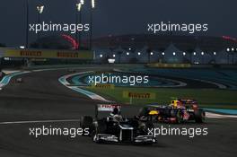 Pastor Maldonado (VEN) Williams FW34 leads Mark Webber (AUS) Red Bull Racing RB8. 04.11.2012. Formula 1 World Championship, Rd 18, Abu Dhabi Grand Prix, Yas Marina Circuit, Abu Dhabi, Race Day.