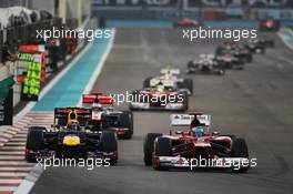 Mark Webber (AUS) Red Bull Racing RB8 and Fernando Alonso (ESP) Ferrari F2012 battle for position. 04.11.2012. Formula 1 World Championship, Rd 18, Abu Dhabi Grand Prix, Yas Marina Circuit, Abu Dhabi, Race Day.