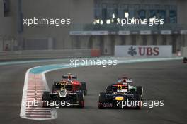 Romain Grosjean (FRA), Lotus F1 Team and Sebastian Vettel (GER), Red Bull Racing  04.11.2012. Formula 1 World Championship, Rd 18, Abu Dhabi Grand Prix, Abu Dhabi, UAE, Race Day