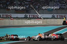 Paul di Resta (GBR) Sahara Force India VJM05 and Sebastian Vettel (GER) Red Bull Racing RB8 battle for position. 04.11.2012. Formula 1 World Championship, Rd 18, Abu Dhabi Grand Prix, Yas Marina Circuit, Abu Dhabi, Race Day.