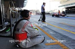 McLaren mechanic watches Fernando Alonso (ESP) Ferrari F2012 pass in the pits.