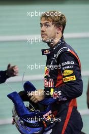 Sebastian Vettel (GER) Red Bull Racing in parc ferme. 03.11.2012. Formula 1 World Championship, Rd 18, Abu Dhabi Grand Prix, Yas Marina Circuit, Abu Dhabi, Qualifying Day.
