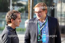 Alain Prost (FRA) (Left) with Arnaud Pericard (FRA) Lawyer in charge planned French GP. 03.11.2012. Formula 1 World Championship, Rd 18, Abu Dhabi Grand Prix, Yas Marina Circuit, Abu Dhabi, Qualifying Day.