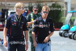Sebastian Vettel (GER) Red Bull Racing with Heikki Huovinen (FIN) Personal Trainer. 03.11.2012. Formula 1 World Championship, Rd 18, Abu Dhabi Grand Prix, Yas Marina Circuit, Abu Dhabi, Qualifying Day.