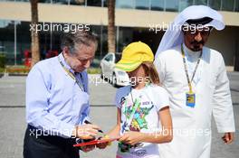 Jean Todt (FRA) FIA President signs autographs for the fans with Mohammed Bin Sulayem (UAE) (Right). 03.11.2012. Formula 1 World Championship, Rd 18, Abu Dhabi Grand Prix, Yas Marina Circuit, Abu Dhabi, Qualifying Day.