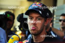 Sebastian Vettel (GER) Red Bull Racing with the media. 01.11.2012. Formula 1 World Championship, Rd 18, Abu Dhabi Grand Prix, Yas Marina Circuit, Abu Dhabi, Preparation Day.