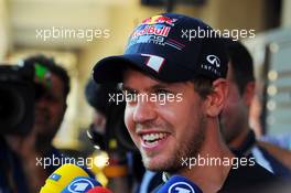 Sebastian Vettel (GER) Red Bull Racing with the media. 01.11.2012. Formula 1 World Championship, Rd 18, Abu Dhabi Grand Prix, Yas Marina Circuit, Abu Dhabi, Preparation Day.