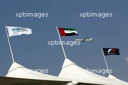 Etihad plane flies past the grandstand flags. 07.11.2012. Formula 1 Young Drivers Test, Day 2, Yas Marina Circuit, Abu Dhabi, UAE.