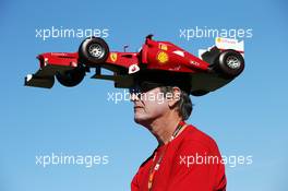 A Ferrari fan with a car on his head. 16.11.2012. Formula 1 World Championship, Rd 19, United States Grand Prix, Austin, Texas, USA, Practice Day.