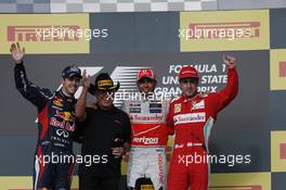 The podium (L to R): Sebastian Vettel (GER) Red Bull Racing, second; Mario Andretti (USA); Lewis Hamilton (GBR) McLaren, race winner; Fernando Alonso (ESP) Ferrari, third. 18.11.2012. Formula 1 World Championship, Rd 19, United States Grand Prix, Austin, Texas, USA, Race Day.