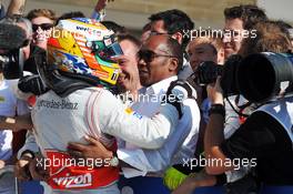 Race winner Lewis Hamilton (GBR) McLaren celebrates in parc ferme with his father Anthony Hamilton (GBR). 18.11.2012. Formula 1 World Championship, Rd 19, United States Grand Prix, Austin, Texas, USA, Race Day.
