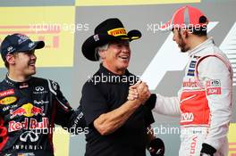 The podium (L to R): Sebastian Vettel (GER) Red Bull Racing, second; Mario Andretti (USA); Lewis Hamilton (GBR) McLaren, race winner. 18.11.2012. Formula 1 World Championship, Rd 19, United States Grand Prix, Austin, Texas, USA, Race Day.