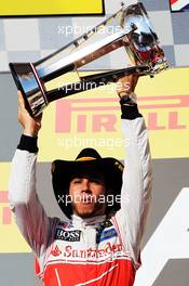 Race winner Lewis Hamilton (GBR) McLaren celebrates on the podium. 18.11.2012. Formula 1 World Championship, Rd 19, United States Grand Prix, Austin, Texas, USA, Race Day.