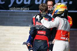 Race winner Lewis Hamilton (GBR) McLaren celebrates with second placed Sebastian Vettel (GER) Red Bull Racing in parc ferme. 18.11.2012. Formula 1 World Championship, Rd 19, United States Grand Prix, Austin, Texas, USA, Race Day.