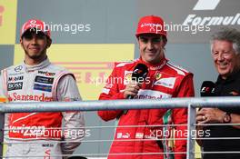 (L to R): race winner Lewis Hamilton (GBR) McLaren with Fernando Alonso (ESP) Ferrari and Mario Andretti (USA) on the podium. 18.11.2012. Formula 1 World Championship, Rd 19, United States Grand Prix, Austin, Texas, USA, Race Day.