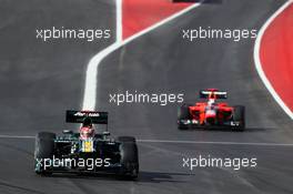 Heikki Kovalainen (FIN) Caterham CT01 leaves the pits ahead of Timo Glock (GER) Marussia F1 Team MR01. 18.11.2012. Formula 1 World Championship, Rd 19, United States Grand Prix, Austin, Texas, USA, Race Day.