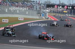 Jenson Button (GBR) McLaren MP4/27 passes Nico Rosberg (GER) Mercedes AMG F1 W03. 18.11.2012. Formula 1 World Championship, Rd 19, United States Grand Prix, Austin, Texas, USA, Race Day.