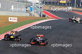 Lewis Hamilton (GBR) McLaren MP4/27 passes Sebastian Vettel (GER) Red Bull Racing RB8 for the lead of the race. 18.11.2012. Formula 1 World Championship, Rd 19, United States Grand Prix, Austin, Texas, USA, Race Day.