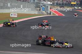 Sebastian Vettel (GER) Red Bull Racing RB8 leads as Mark Webber (AUS) Red Bull Racing RB8 and Lewis Hamilton (GBR) McLaren MP4/27 battle for position. 18.11.2012. Formula 1 World Championship, Rd 19, United States Grand Prix, Austin, Texas, USA, Race Day.