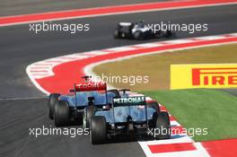 Michael Schumacher (GER) Mercedes AMG F1 W03 and Jenson Button (GBR) McLaren MP4/27 battle for position. 18.11.2012. Formula 1 World Championship, Rd 19, United States Grand Prix, Austin, Texas, USA, Race Day.