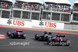 Daniel Ricciardo (AUS) Scuderia Toro Rosso STR7 leads Vitaly Petrov (RUS) Caterham CT01 and Timo Glock (GER) Marussia F1 Team MR01. 18.11.2012. Formula 1 World Championship, Rd 19, United States Grand Prix, Austin, Texas, USA, Race Day.