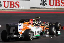 Romain Grosjean (FRA) Lotus F1 E20 leads Nico Hulkenberg (GER) Sahara Force India F1 VJM05. 18.11.2012. Formula 1 World Championship, Rd 19, United States Grand Prix, Austin, Texas, USA, Race Day.