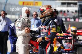 Sebastian Vettel (GER) Red Bull Racing celebrates his pole position in parc ferme with Michael Schumacher (GER) Mercedes AMG F1. 17.11.2012. Formula 1 World Championship, Rd 19, United States Grand Prix, Austin, Texas, USA, Qualifying Day.