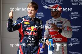 Sebastian Vettel (GER) Red Bull Racing celebrates his pole position in parc ferme with Lewis Hamilton (GBR) McLaren. 17.11.2012. Formula 1 World Championship, Rd 19, United States Grand Prix, Austin, Texas, USA, Qualifying Day.