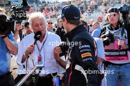 (L to R): Bob Constanduros (GBR) Journalist and Circuit Commentator with Sebastian Vettel (GER) Red Bull Racing. 18.11.2012. Formula 1 World Championship, Rd 19, United States Grand Prix, Austin, Texas, USA, Race Day.