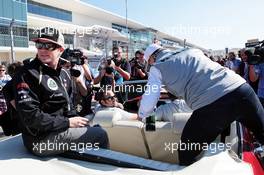 (L to R): Kimi Raikkonen (FIN) Lotus F1 Team is joined by Michael Schumacher (GER) Mercedes AMG F1 in his car on the drivers parade. 18.11.2012. Formula 1 World Championship, Rd 19, United States Grand Prix, Austin, Texas, USA, Race Day.