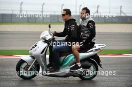 Michael Schumacher (GER) Mercedes AMG F1 rides the circuit on a moped. 15.11.2012. Formula 1 World Championship, Rd 19, United States Grand Prix, Austin, Texas, USA, Preparation Day.