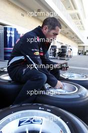 Red Bull Racing mechanic checks Pirelli tyres. 15.11.2012. Formula 1 World Championship, Rd 19, United States Grand Prix, Austin, Texas, USA, Preparation Day.