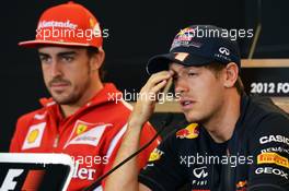 (L to R): Fernando Alonso (ESP) Ferrari with Sebastian Vettel (GER) Red Bull Racing in the FIA Press Conference. 15.11.2012. Formula 1 World Championship, Rd 19, United States Grand Prix, Austin, Texas, USA, Preparation Day.