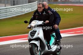 Norbert Haug (GER) Mercedes Sporting Director rides the circuit on a moped. 15.11.2012. Formula 1 World Championship, Rd 19, United States Grand Prix, Austin, Texas, USA, Preparation Day.