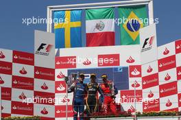 Esteban Gutierrez (MEX), Lotus GP race winner, 2nd position Marcus Ericsson (SUE), iSport International and 3rd position Luiz Razia (BRA), Test Driver, Team Lotus, TL11   23.06.2012. GP2 Series, Rd 6, Valencia, Spain, Saturday